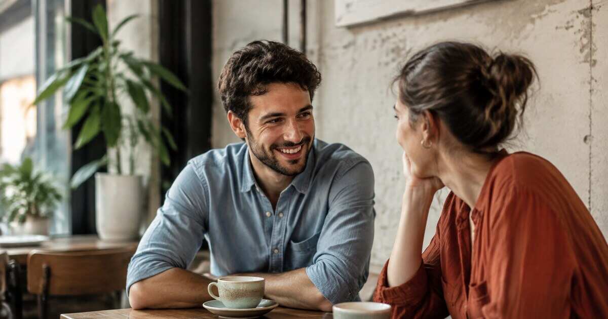 Two people sharing an easy conversation over coffee